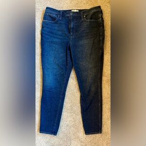 10” high rise skinny dark wash jeans. Good stretch. Measures 27” inseam.